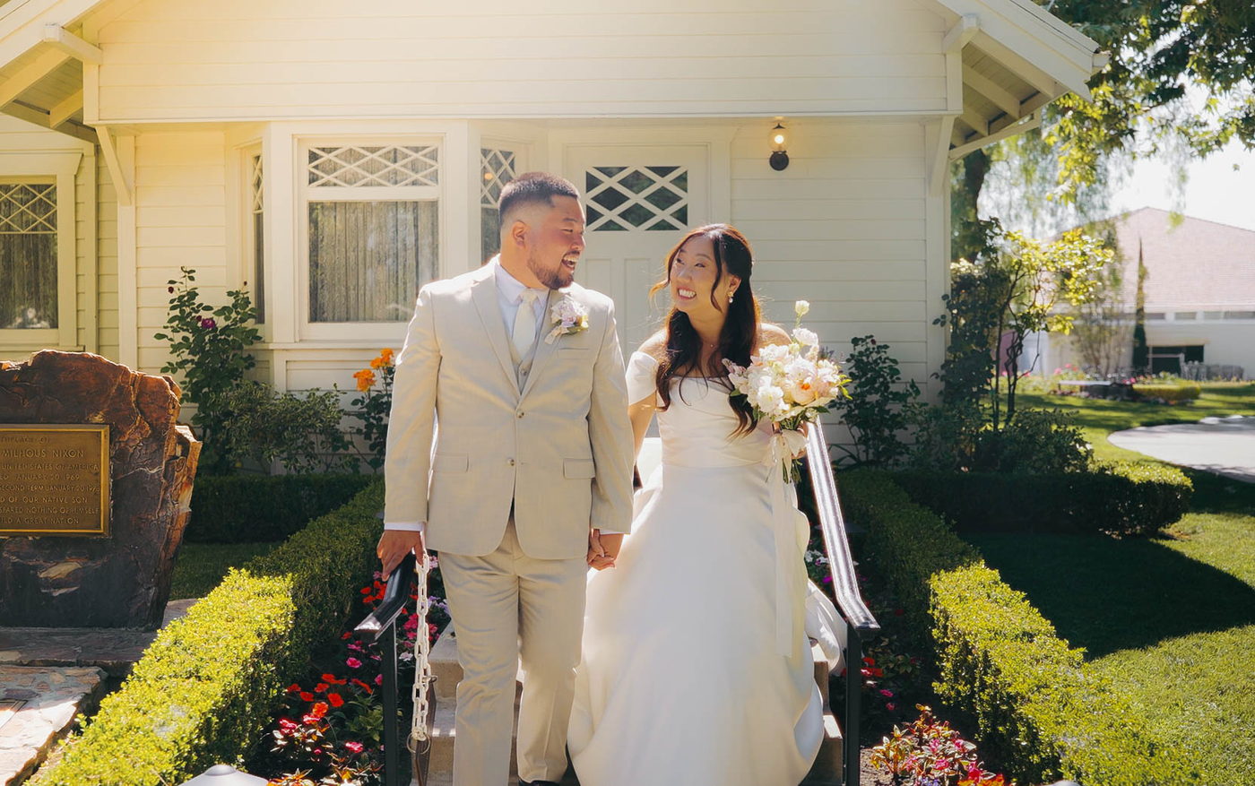 Robin and Jasmin walking hand in hand after their ceremony