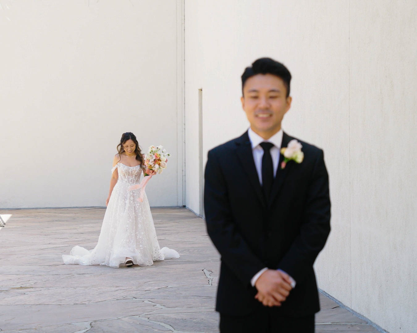 Antonio waiting as Nicole approaches for their first look
